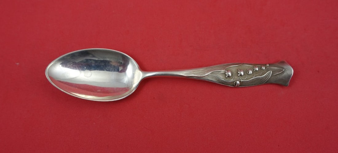 Sterling Silver Teaspoon Flora Pattern by Shiebler Lily of the Valley 5 3/4 Inch: Sterling Silver Teaspoon Flora Pattern by Shiebler Lily of the Valley 5 3/4 Inch This is a Flora pattern sterling silver teaspoon by Shiebler, featuring a lily of the valley design. The spoon measures