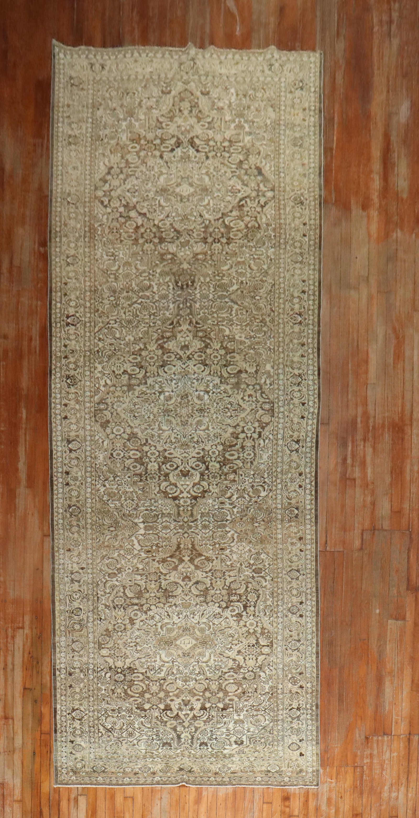 5' 5" x 17' 6" Persian Malayer Gallery Rug 1920s: 5' 5" x 17' 6" Persian Malayer Gallery Rug 1920s Antique Persian Malayer corridor rug from the 1920s in a brown colorway. This pre-owned gallery-size rug features the long, narrow proportions typical 