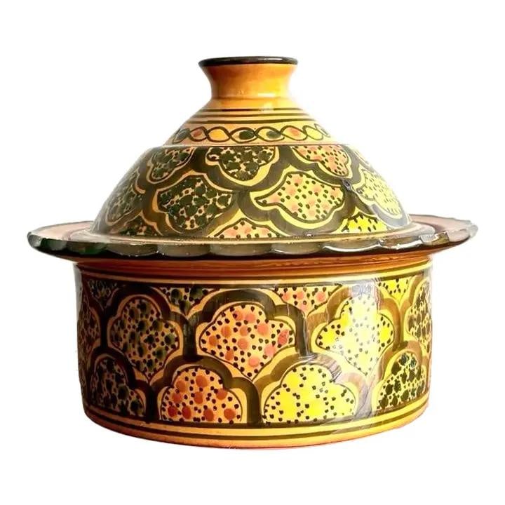 Moroccan-Style Vintage Glazed Ceramic Tagine Dish: Moroccan-Style Vintage Glazed Ceramic Tagine Dish Discover this Vintage Boho Glazed Lidded Ceramic Dish, a stunning piece that embodies Moroccan-style craftsmanship. This vibrant ceramic vessel featur