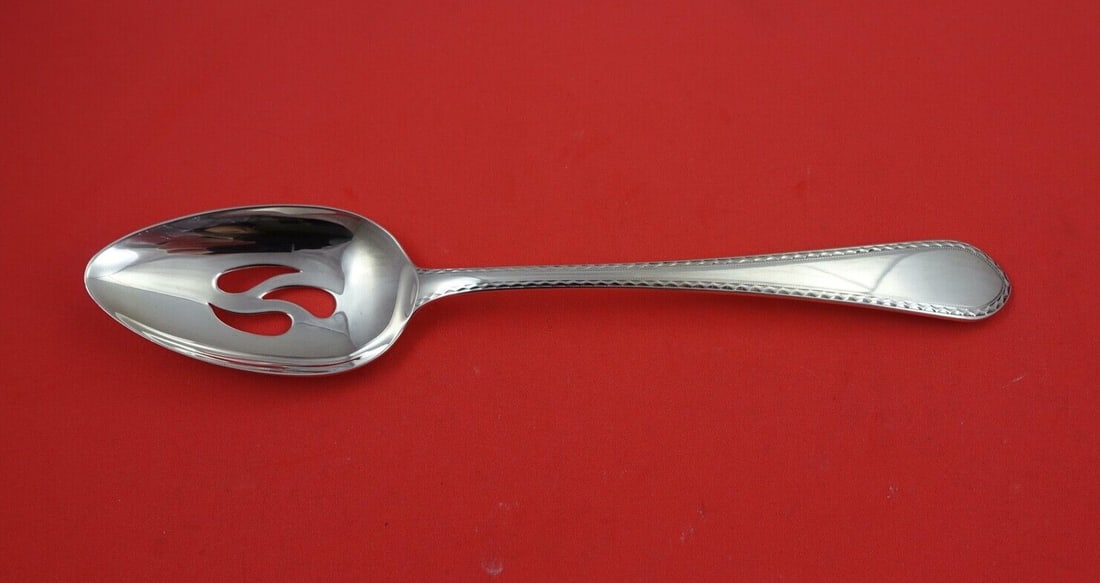Lunt Sterling Silver Early Colonial Pierced Serving Spoon 8 5/8 Inches: Lunt Sterling Silver Early Colonial Pierced Serving Spoon 8 5/8 Inches This exquisite serving spoon features the elegant Early Colonial pattern by Lunt, crafted from high-quality sterling silver. Meas