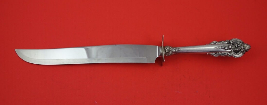 Wallace Grande Baroque Sterling Silver Roast Carving Knife 13 3/4": Wallace Grande Baroque Sterling Silver Roast Carving Knife 13 3/4" This exquisite Grande Baroque roast carving knife showcases the timeless craftsmanship of Wallace. Made from high-quality sterling si