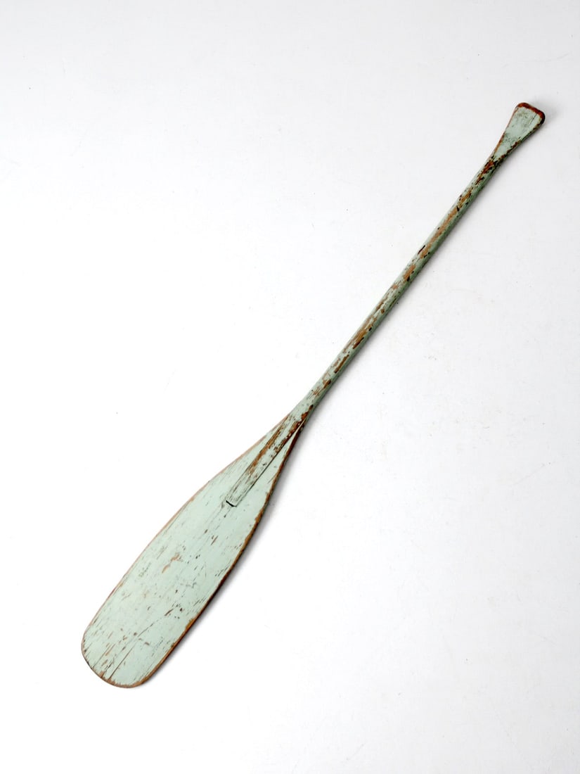 Vintage Seafoam Green Wooden Oar Nautical Decor 59.75": Vintage Seafoam Green Wooden Oar Nautical Decor 59.75" This vintage painted wooden oar showcases a beautifully aged seafoam green paint, perfect for adding a nautical touch to your decor. Ideal as a d