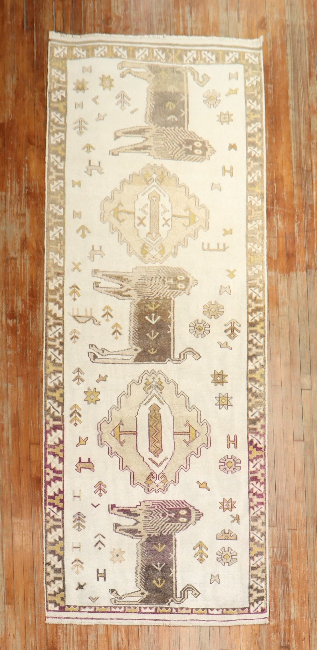 4' 2" x 12' Turkish Anatolian Pictorial Runner with Lions: 4' 2" x 12' Turkish Anatolian Pictorial Runner with Lions Vintage Turkish Anatolian pictorial runner featuring three large lions on an ivory field. This mid-20th century rug is a pre-owned piece with 