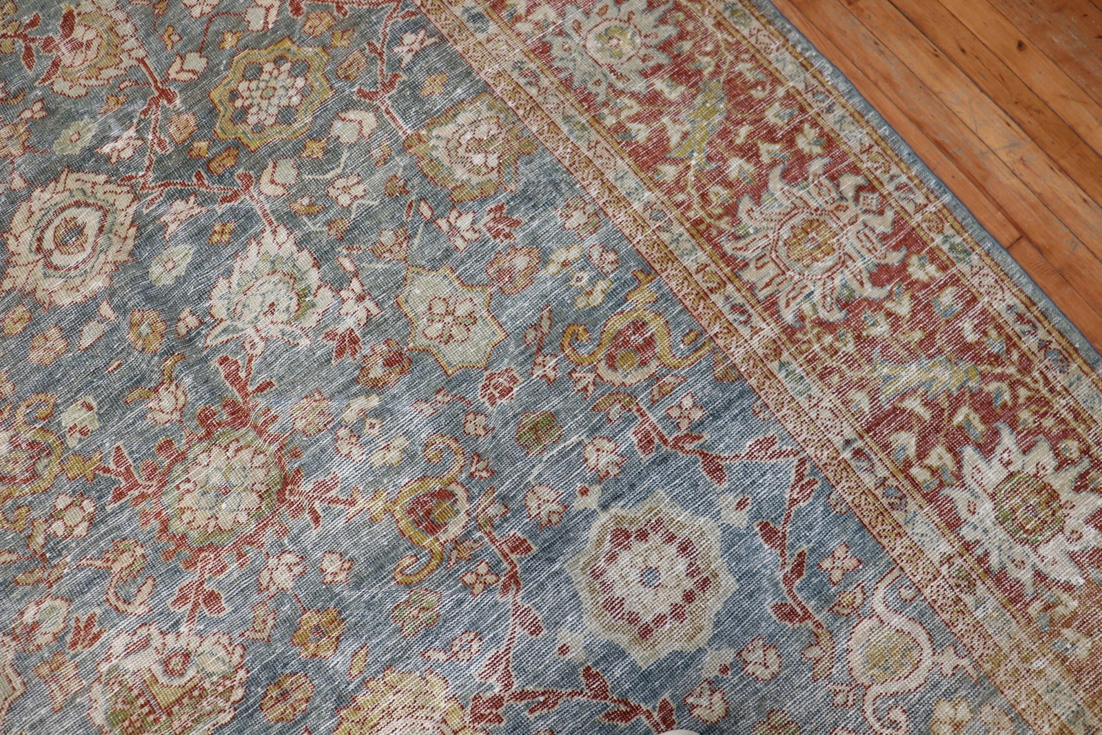 9' 4" x 12' 3" Persian Mahal room rug in blue rust tones: 9' 4" x 12' 3" Persian Mahal room rug in blue rust tones Early 20th century Persian Mahal room-size rug with evenly worn pile and rustic blue and rust tones. This pre-owned piece is described as a Sha