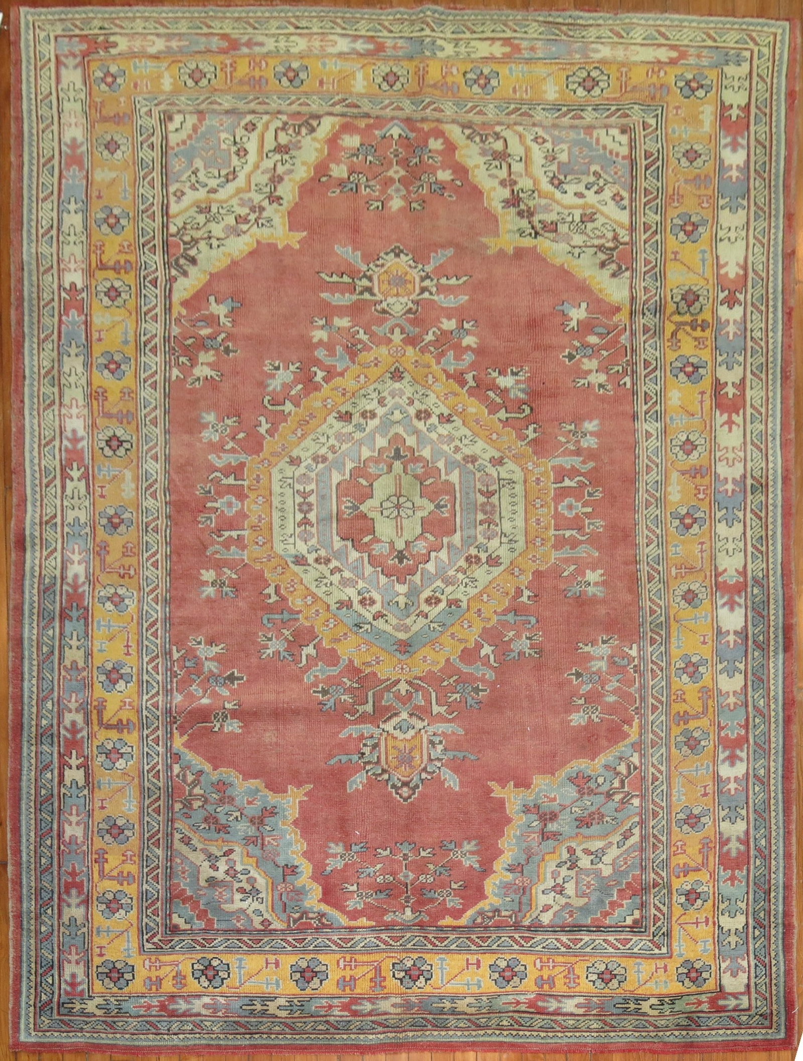 6' 6" x 9' 2" Vintage Turkish Oushak Rug Red Ground: 6' 6" x 9' 2" Vintage Turkish Oushak Rug Red Ground Vintage Turkish Oushak medallion rug from the 1940s featuring mustard yellow and green accents on a red ground. This pre-owned piece reflects the cl