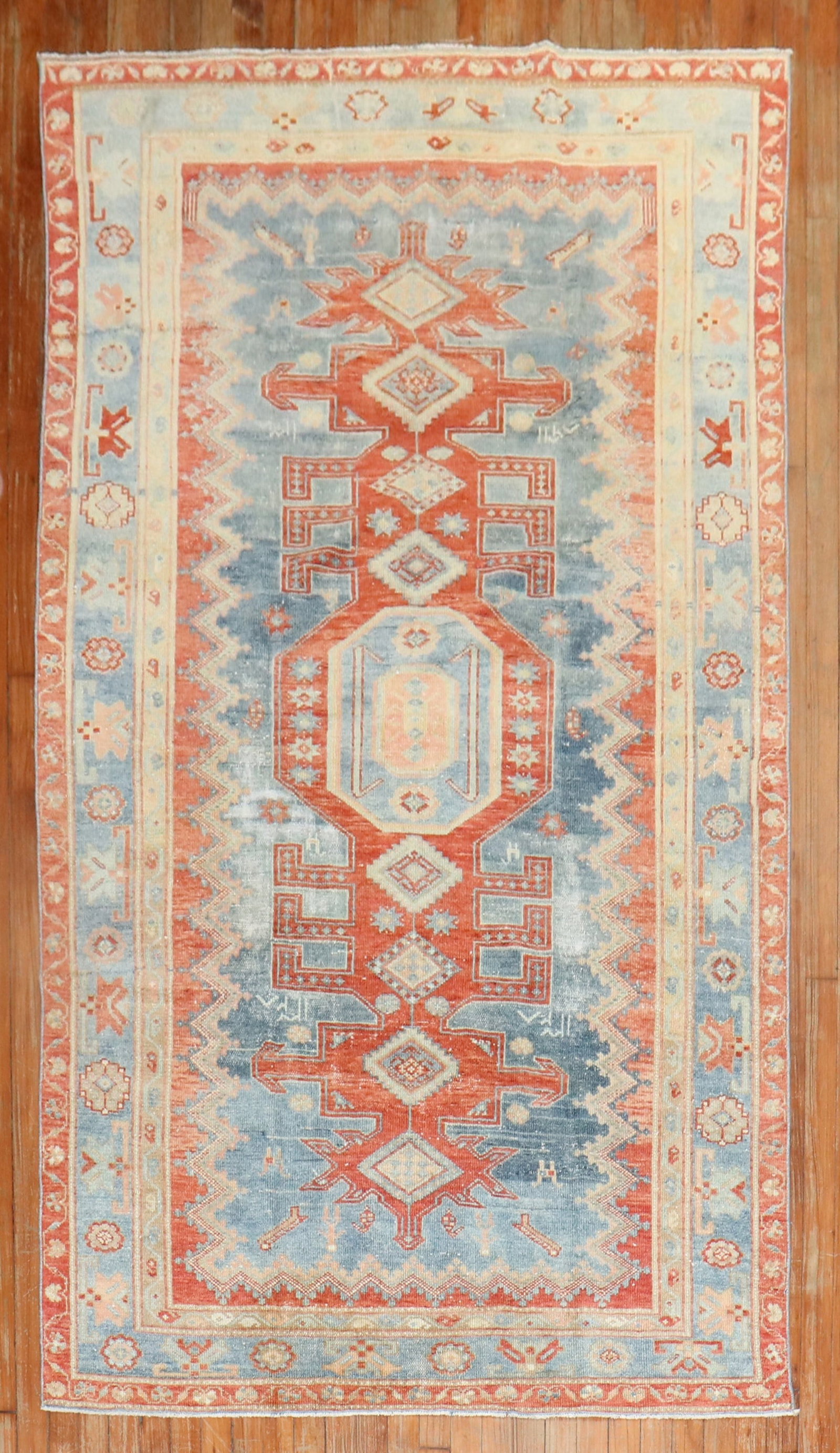 4' 6" x 7' 9" Kazak Caucasian Rug in Blue and Rust Red: 4' 6" x 7' 9" Kazak Caucasian Rug in Blue and Rust Red A pre-owned 1930s Caucasian Kazak rug in blue and rusty red tones. This decorative rug presents a classic Caucasian design and is identified as a