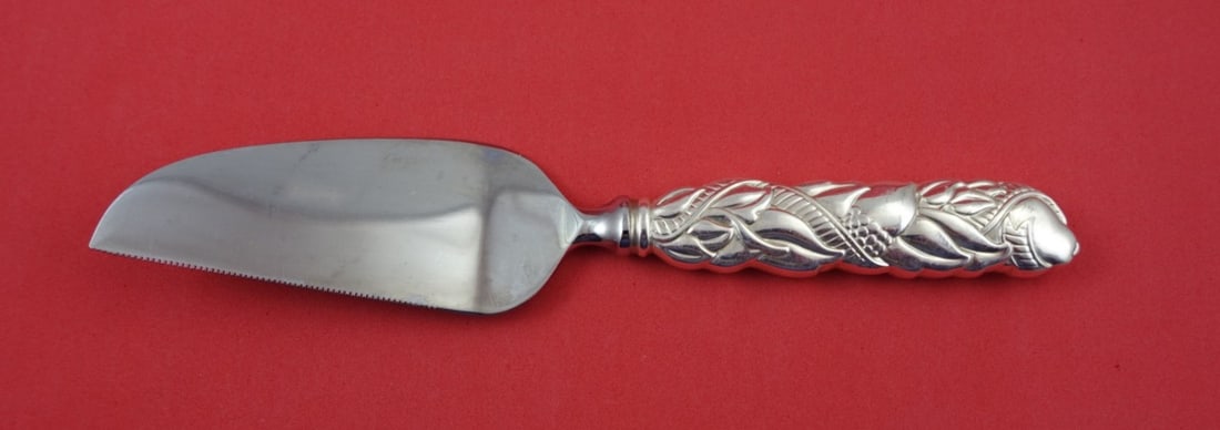 Sterling Silver Cheese Server 7 Inch Celebration Motif by Tiffany: Sterling Silver Cheese Server 7 Inch Celebration Motif by Tiffany This Tiffany & Co. sterling silver cheese server features a hollow handle and a stainless steel implement with a celebration motif. Th
