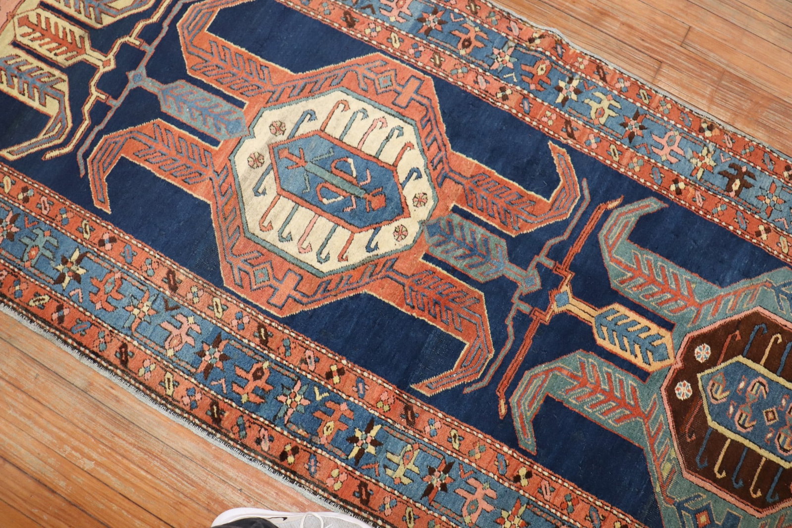 3' 6" x 18' Persian Heriz Serapi Runner Blue Tribal Rug: 3' 6" x 18' Persian Heriz Serapi Runner Blue Tribal Rug Early 20th century Persian Serapi/Heriz runner with a tribal design and intricate geometric patterning. Presented in blue tones with red and cre