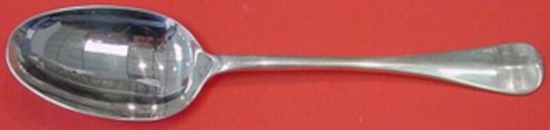 Stieff Sterling Silver Queen Anne-Williamsburg Serving Spoon 7 7/8": Stieff Sterling Silver Queen Anne-Williamsburg Serving Spoon 7 7/8" This exquisite serving spoon is crafted from sterling silver and features the elegant Queen Anne-Williamsburg pattern by Stieff, a r