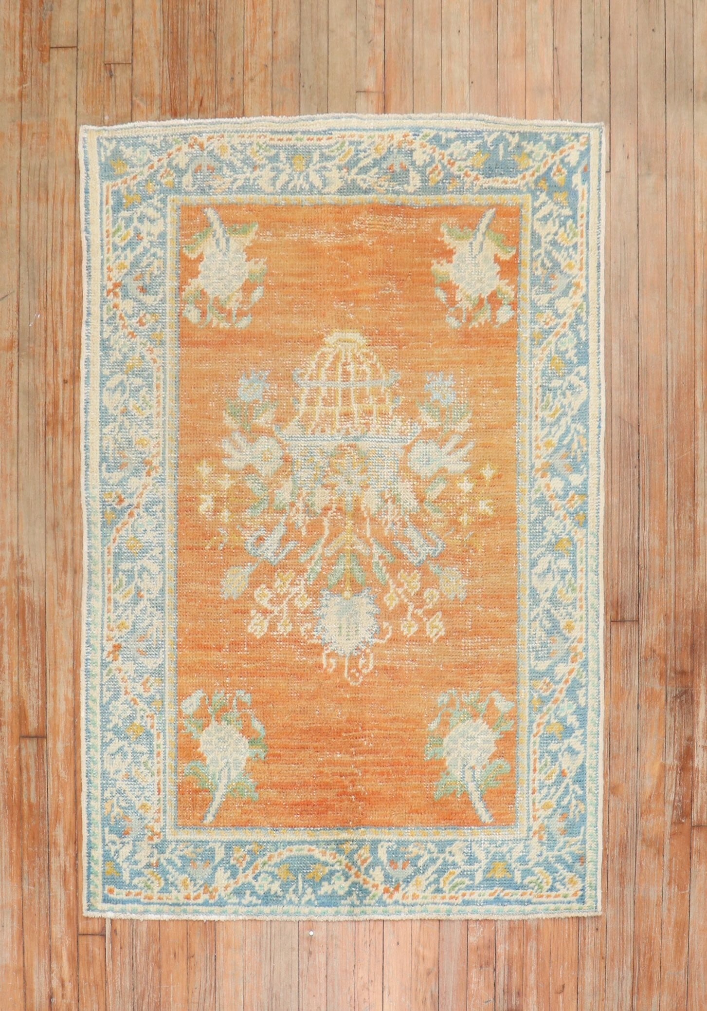 3' 7" x 4' 10" Floral Turkish Oushak Scatter Rug 1930s: 3' 7" x 4' 10" Floral Turkish Oushak Scatter Rug 1930s Antique Turkish Oushak scatter rug from the 1930s featuring a floral design. This pre-owned small rug presents an orange-toned palette consistent