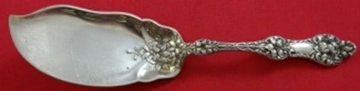 Alvin Old Orange Blossom sterling jelly knife 7 1/4 in: Alvin Old Orange Blossom sterling jelly knife 7 1/4 in Sterling silver jelly knife in the Old Orange Blossom pattern by Alvin. This antique serving piece dates to the 1900-1940 period and is made in t