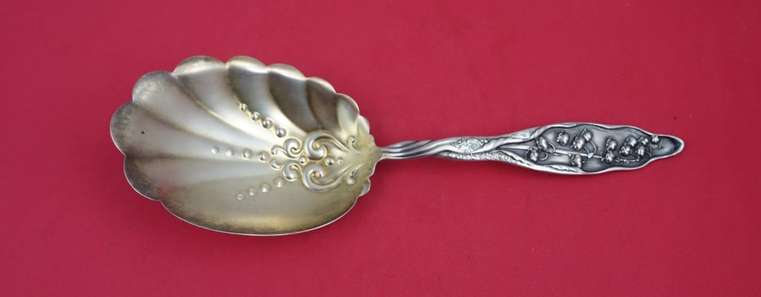 Whiting Lily of the Valley Sterling Silver Serving Spoon 9 5/8": Whiting Lily of the Valley Sterling Silver Serving Spoon 9 5/8" This exquisite pudding spoon from the renowned Whiting Silver Company showcases the elegant Lily of the Valley pattern, which was patent