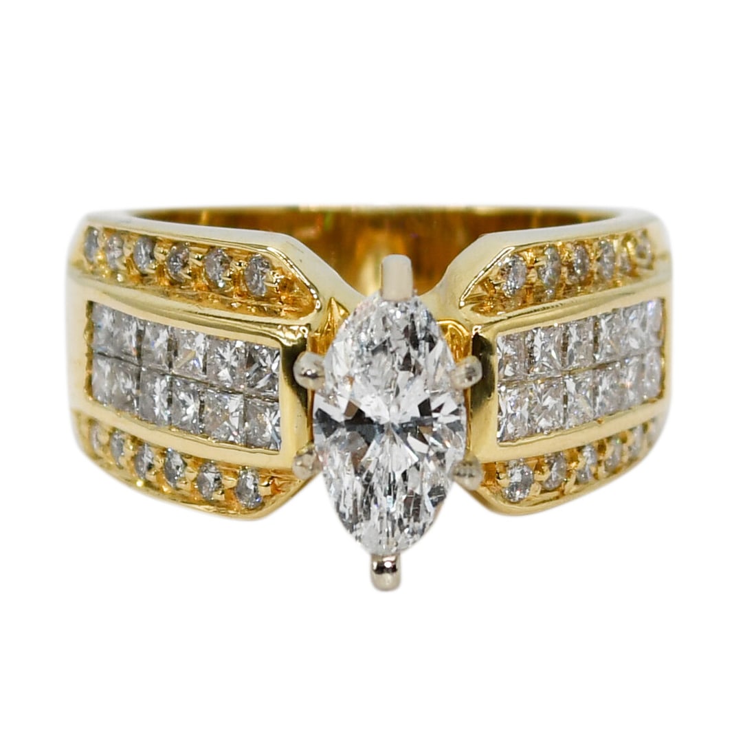 Marquise Diamond Solitaire Ring in 18K Yellow Gold 1.98ct: Marquise Diamond Solitaire Ring in 18K Yellow Gold 1.98ct Pre-owned marquise diamond ring crafted in 18k yellow gold with a natural center diamond and additional princess and round brilliant cut side 