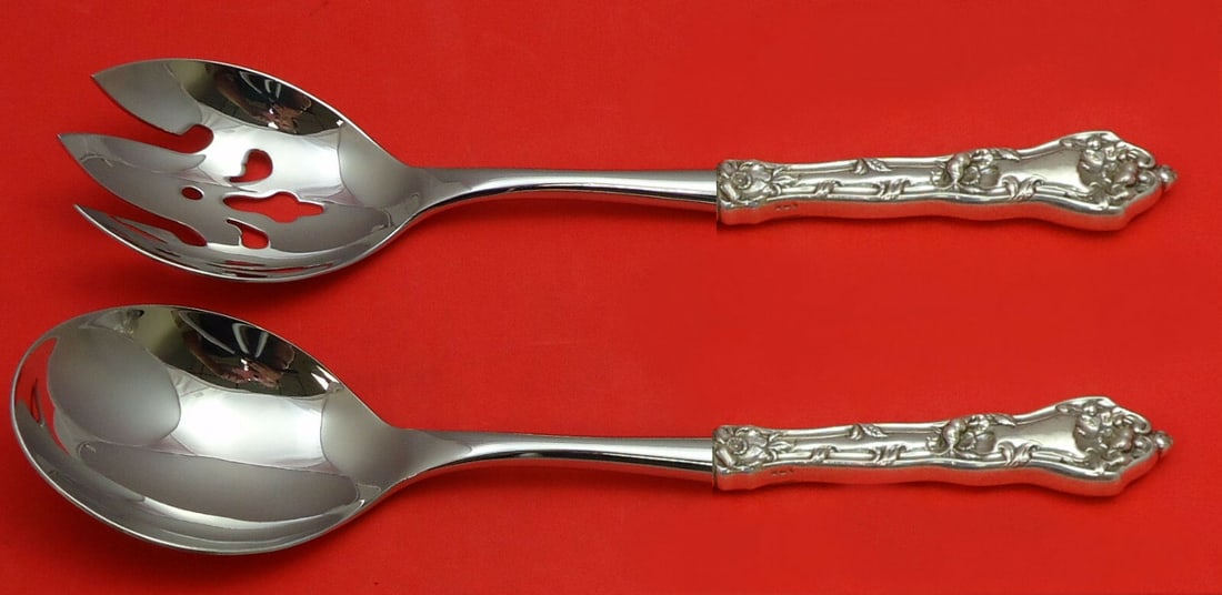 Reed and Barton Intaglio Sterling Silver Salad Serving Set 2pc: Reed and Barton Intaglio Sterling Silver Salad Serving Set 2pc This exquisite 2-piece salad serving set from Reed and Barton is crafted in sterling silver, featuring the elegant Intaglio pattern. The 