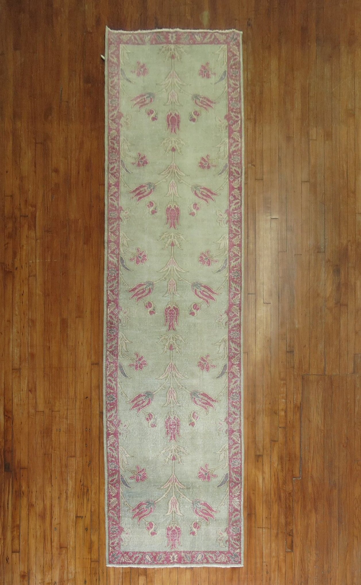 3' 5" x 12' 10" Turkish Runner Rug in Green and Pink: 3' 5" x 12' 10" Turkish Runner Rug in Green and Pink Mid-20th century Turkish runner with a feminine design in green and pink tones. This pre-owned rug features a long runner format suitable for hallw