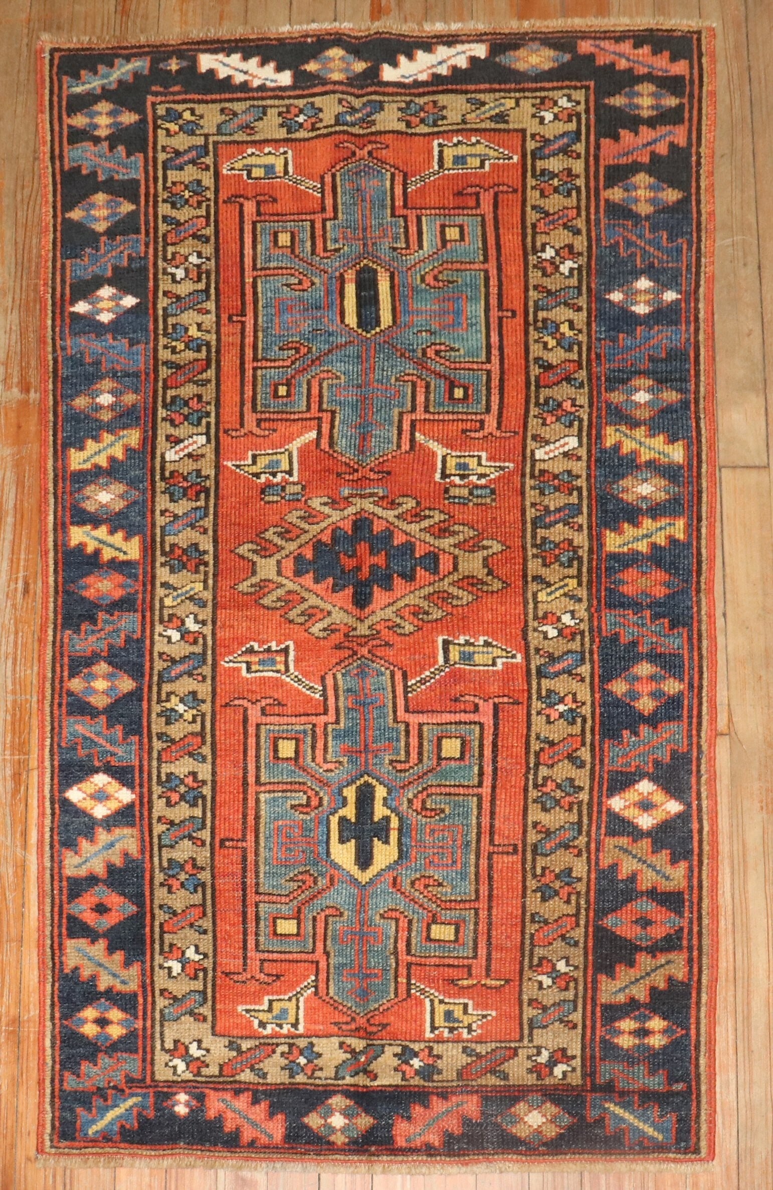 2' 8" x 4' 6" Persian Serapi Heriz Small Rug: 2' 8" x 4' 6" Persian Serapi Heriz Small Rug Pre-owned 1920s Persian Heriz rug in a small scatter size. This Serapi/Heriz rug features a geometric design with red, blue, and beige tones. Specification
