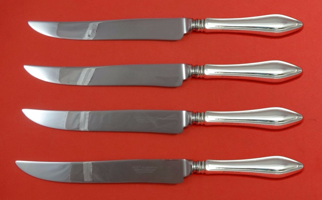 Towle Mary Chilton Sterling Silver 4pc Texas Sized Steak Knife Set: Towle Mary Chilton Sterling Silver 4pc Texas Sized Steak Knife Set This set includes four sterling silver hollow handle steak knives with stainless steel blades, designed in the Mary Chilton pattern b