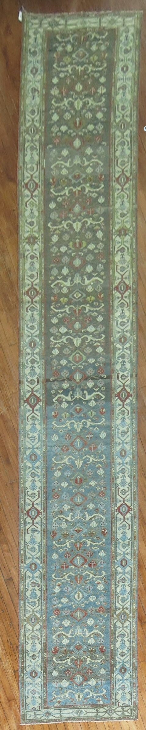 3' x 19' 4" Persian Malayer runner in green and blue: 3' x 19' 4" Persian Malayer runner in green and blue Early 20th century Persian Malayer runner with predominant green and blue tones. This pre-owned rug features the long runner format and traditional