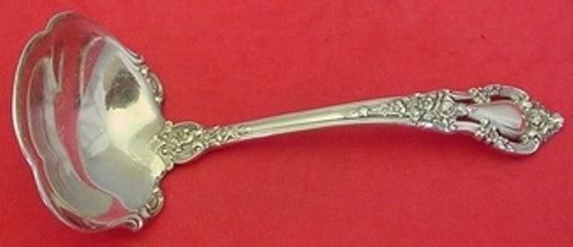 Lunt Eloquence Sterling Silver Gravy Ladle 6.5 Inch Serving Piece: Lunt Eloquence Sterling Silver Gravy Ladle 6.5 Inch Serving Piece Elevate your dining experience with this exquisite Eloquence by Lunt Sterling Silver Gravy Ladle. Measuring 6 1/2 inches, this ladle s