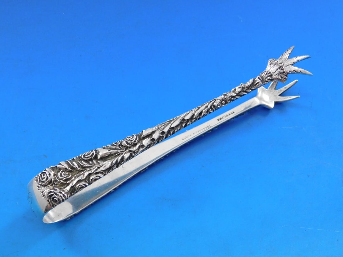 Theodore Starr Sterling Silver Rose Pattern Sugar Tongs 5.5 inches: Theodore Starr Sterling Silver Rose Pattern Sugar Tongs 5.5 inches This exquisite sugar tong features the elegant 'Rose' pattern, crafted from high-quality sterling silver (.925). Measuring 5 1/2 inch