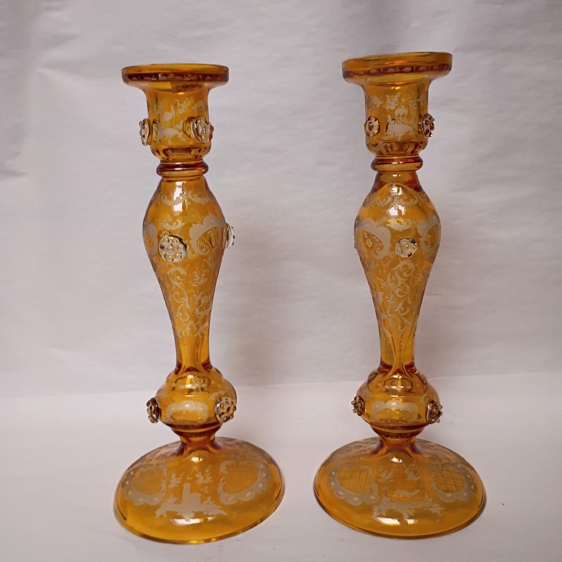 Pair of 12 inch Bohemia glass candlesticks with etched floral deer motif: Pair of 12 inch Bohemia glass candlesticks with etched floral deer motif Antique Bohemian cut and engraved candlesticks with etched decoration and a cut-to-clear design. This original hand-blown art g