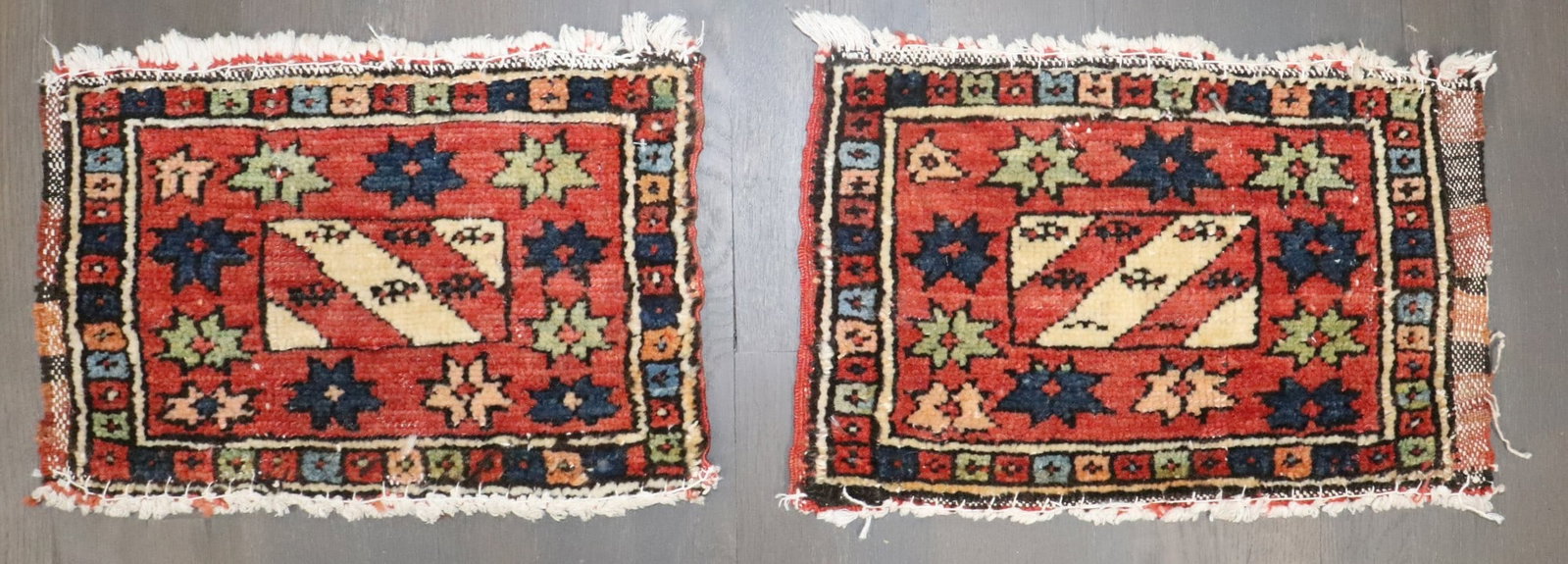 Pair of Early 20th Century N.W. Persian Yastik Rugs 10" x 1' 4": Pair of Early 20th Century N.W. Persian Yastik Rugs 10" x 1' 4" Pair of early 20th century Northwest Persian bagface rugs with geometric motifs and a traditional yastik form. Offered as a pre-owned pa