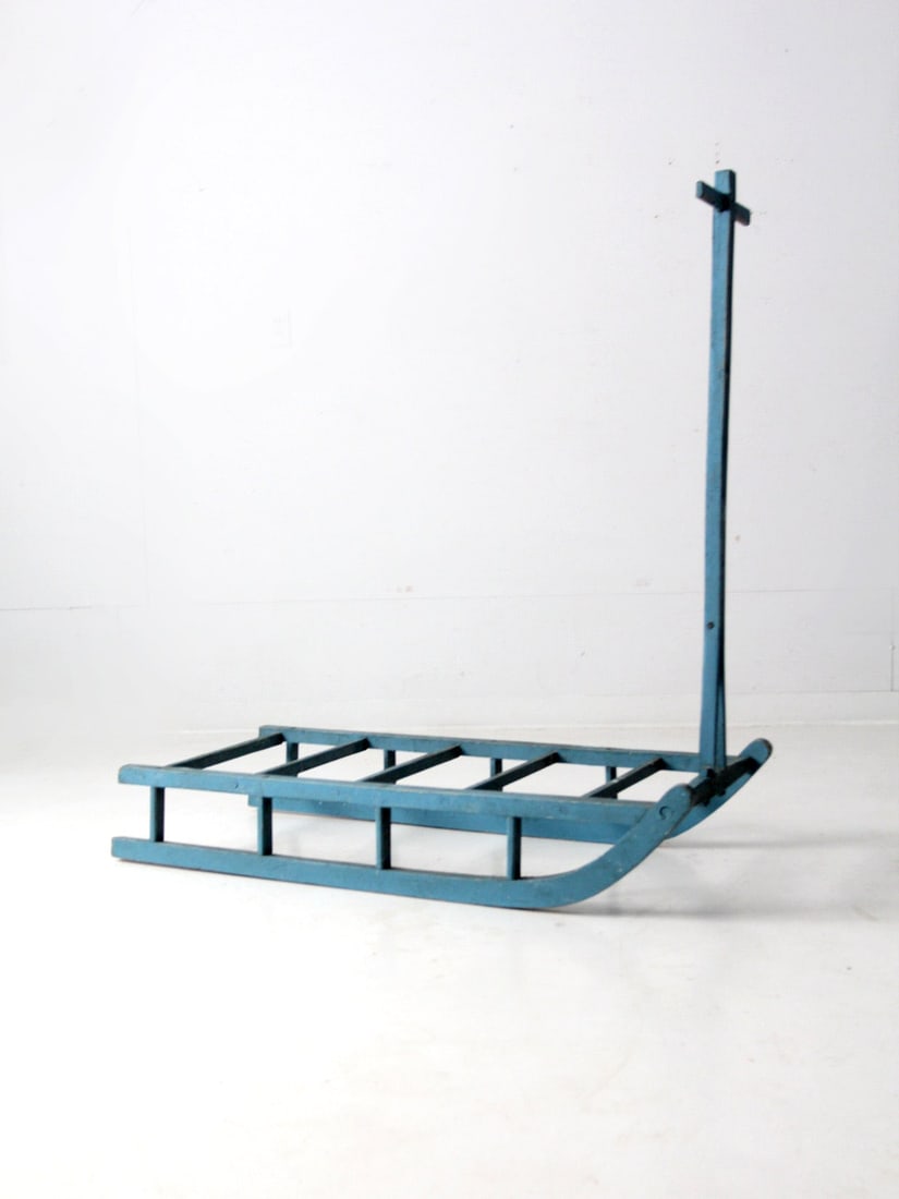 Charming Antique Wooden Snow Sled Cart 48 x 21 inches: Charming Antique Wooden Snow Sled Cart 48 x 21 inches This antique wooden snow sled cart features a charming hand-built design with a painted sled frame and slat wood top. The sky blue paint shows del