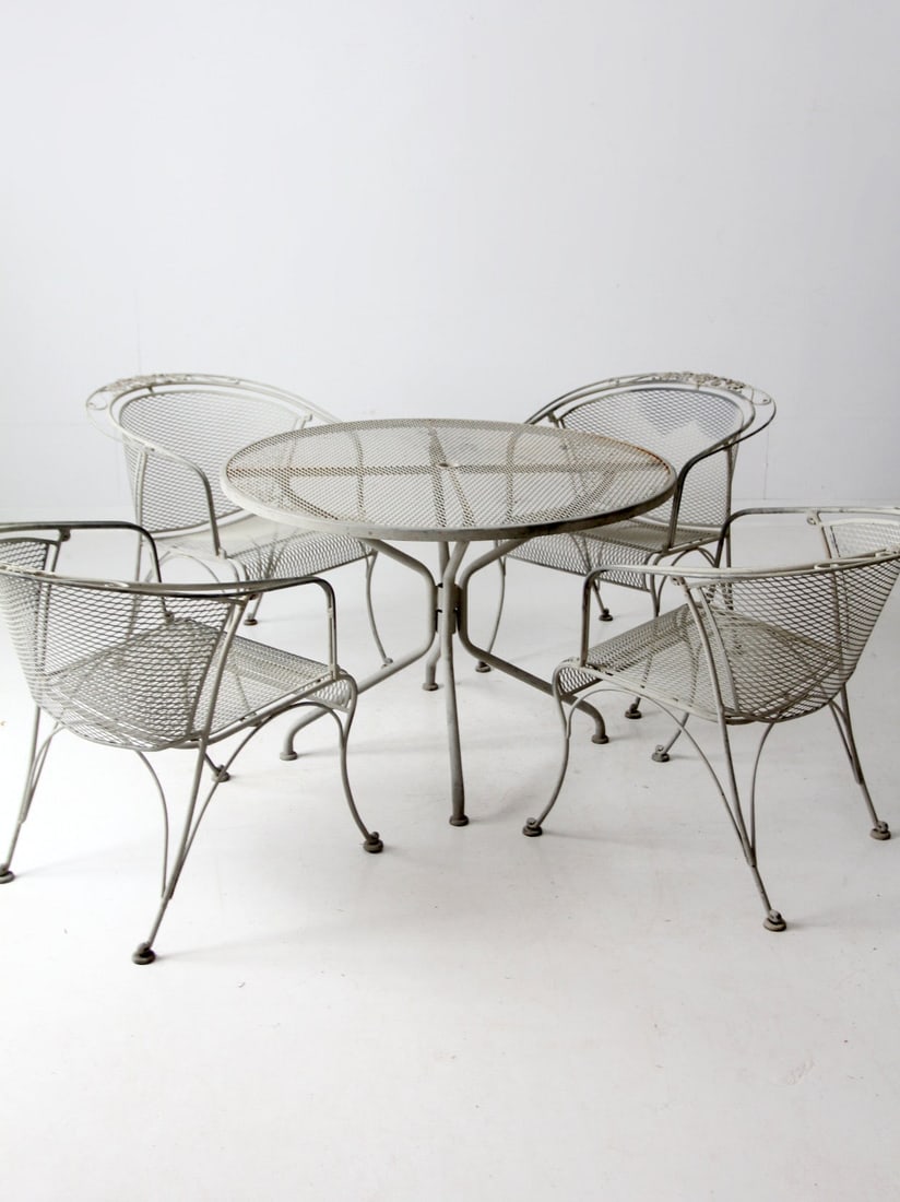 Vintage Mid-Century Wrought Iron Outdoor Dining Set with Garden Design: Vintage Mid-Century Wrought Iron Outdoor Dining Set with Garden Design Elevate your outdoor dining experience with this exquisite Mid-Century Outdoor Dining Set. Crafted from durable wrought iron, thi