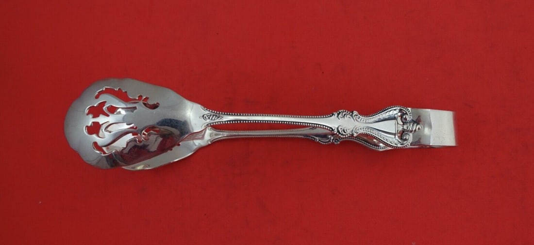 Towle Old Colonial Sterling Silver Ice Tongs 7.25 Inch Serving Piece: Towle Old Colonial Sterling Silver Ice Tongs 7.25 Inch Serving Piece Introducing the exquisite Old Colonial ice tongs by Towle, a true masterpiece in sterling silver. This elegant serving piece, measu