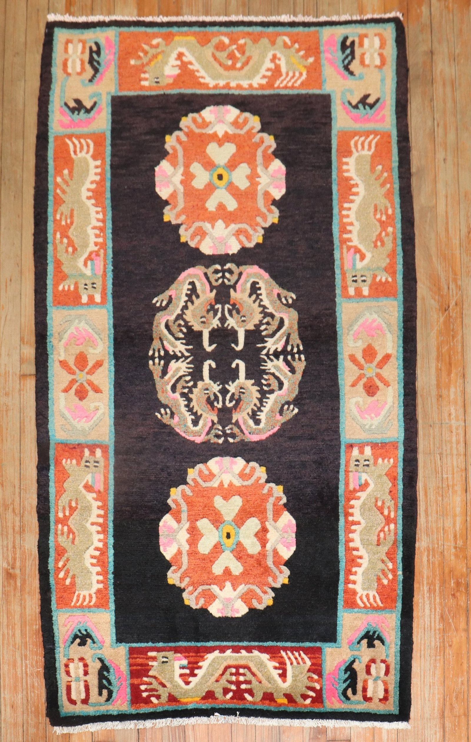 3' 1" x 5' 7" Mid 20th Century Tibetan Pictorial Dragon Rug: 3' 1" x 5' 7" Mid 20th Century Tibetan Pictorial Dragon Rug Vintage decorative Tibetan pictorial rug featuring a 10-dragon motif. This mid-20th century piece is a small pre-owned rug with bold decorat