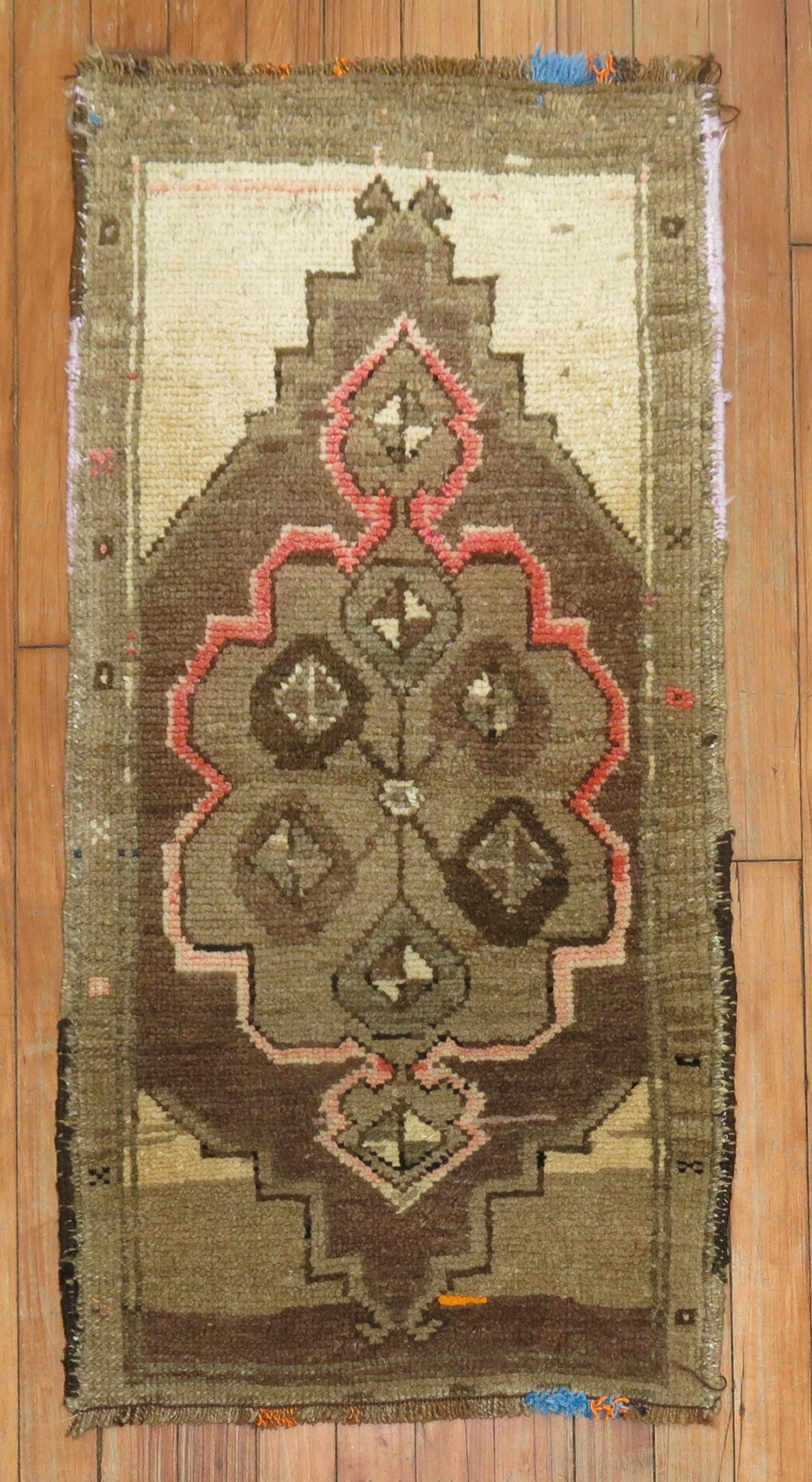 1' 7" x 3' Mid Century Turkish Anatolian Yastik Rug: 1' 7" x 3' Mid Century Turkish Anatolian Yastik Rug Vintage Turkish Anatolian yastik rug with a geometric design and central floral motif. This pre-owned piece reflects a mid-century style and compact