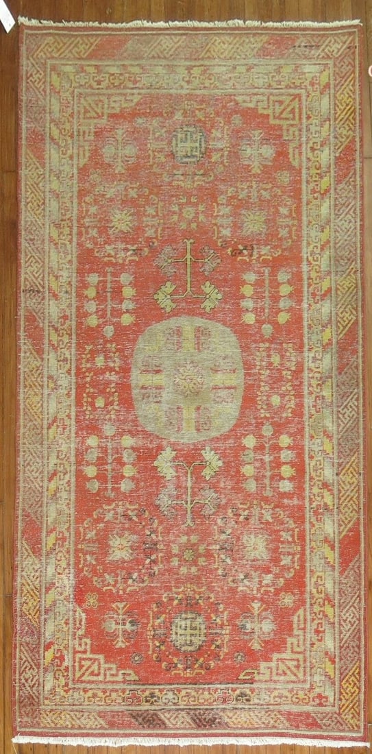4' 8" x 9' 2" Early 20th Century Red Khotan Rug: 4' 8" x 9' 2" Early 20th Century Red Khotan Rug Antique Khotan rug from the early 20th century with a red field and traditional patterning. This pre-owned rug is identified as a Khotan, Samarkand type