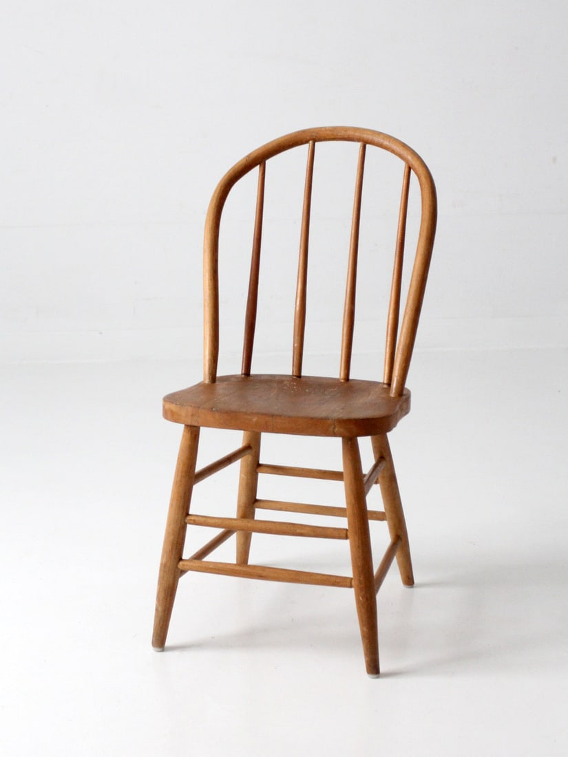 Windsor Style Farmhouse Side Chair with Bow Back: Windsor Style Farmhouse Side Chair with Bow Back Antique Windsor style dining chair with a shaped wood seat, tall spindle back, and gently curved bow crest. It has a warm worn finish and is described 