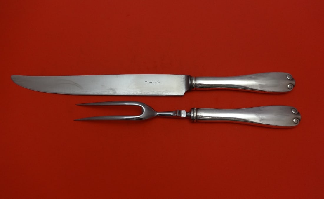 Tiffany & Co. Flemish Sterling Silver 2-Piece Carving Set: Tiffany & Co. Flemish Sterling Silver 2-Piece Carving Set Enhance your dining experience with this exquisite 2-piece roast carving set from Tiffany & Co., featuring the elegant Flemish pattern. Crafte