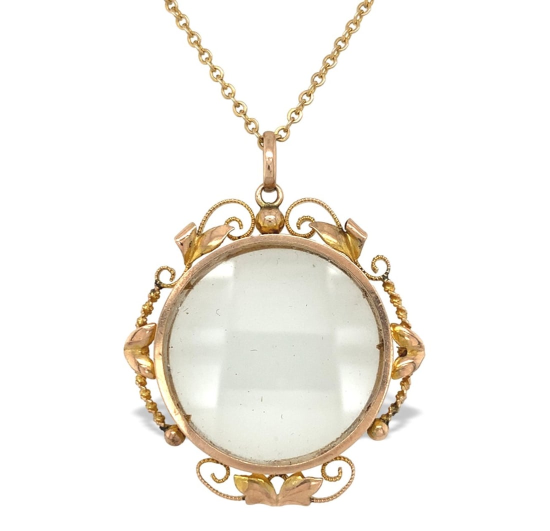Victorian 9k Yellow Gold Glass Locket with 10k Gold Chain: Victorian 9k Yellow Gold Glass Locket with 10k Gold Chain This exquisite Victorian locket is crafted from 9k yellow gold and features a charming glass center adorned with applied leaves and intricate 