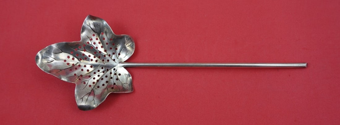 Sterling Silver Leaf Bowl Sugar Sifter by Shiebler 8 1/8 Inch: Sterling Silver Leaf Bowl Sugar Sifter by Shiebler 8 1/8 Inch This sterling silver sugar sifter by Shiebler features a pierced leaf-shaped bowl and a stem-like handle. Crafted between 1850 and 1899, i