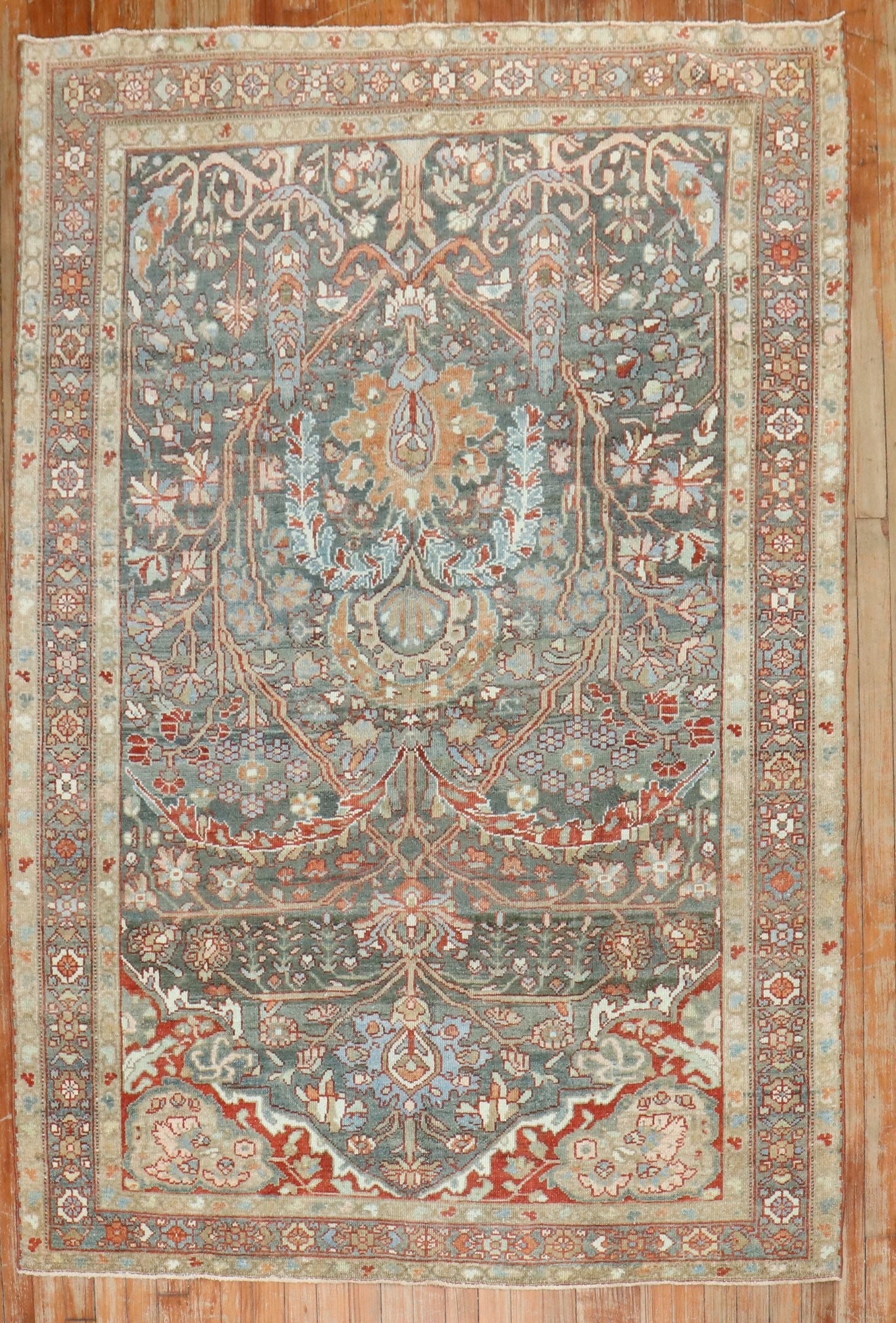4' 11" x 6' 9" Persian Malayer Rug in Earth Tones: 4' 11" x 6' 9" Persian Malayer Rug in Earth Tones Vintage Persian Malayer rug from the 1920s featuring a directional pattern in earth tones. This pre-owned piece reflects the classic character of Mala