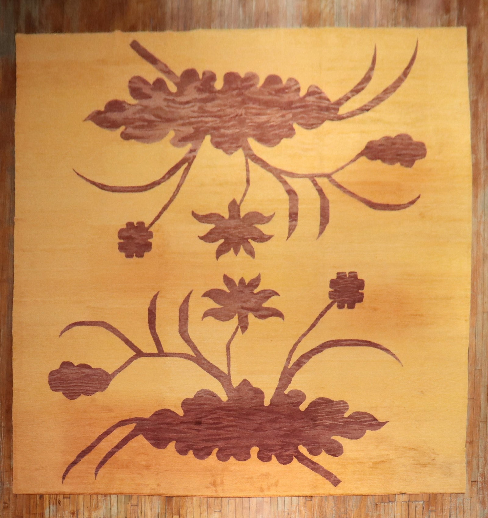 12' 8" x 17' 6" Oversize Tibetan Wool Rug Orange Floral Design: 12' 8" x 17' 6" Oversize Tibetan Wool Rug Orange Floral Design Oversize Tibetan decorative wool rug featuring a large floral design on a borderless orange sherbet field. Pre-owned. Specifications Item