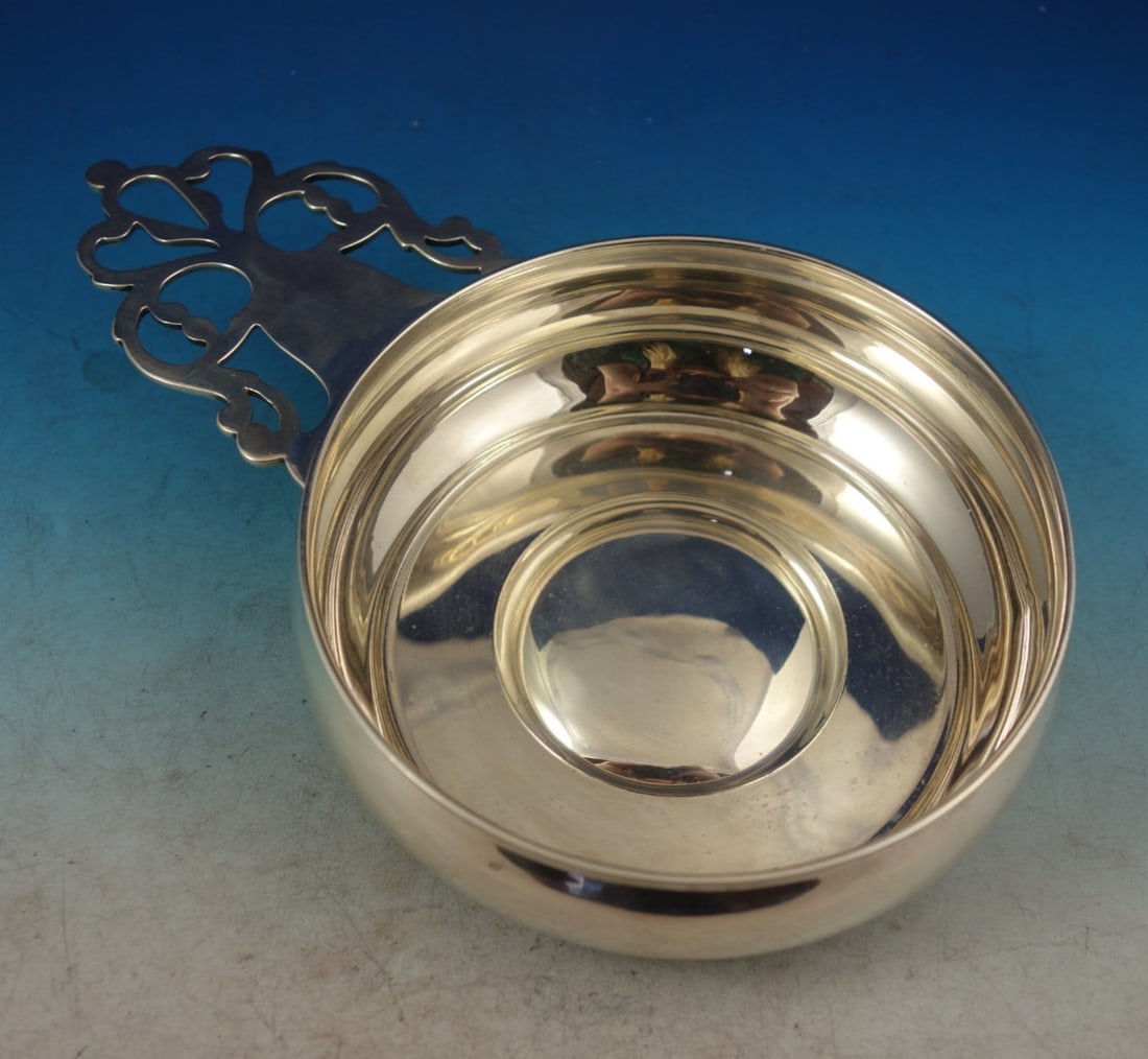 Sterling Silver Porringer with Pierced Handle by Tiffany Pattern 19206: Sterling Silver Porringer with Pierced Handle by Tiffany Pattern 19206 This is a Tiffany & Co. sterling silver porringer featuring a pierced handle. The piece is marked and has no monogram. It is in g
