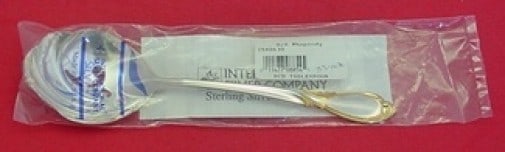 International Rhapsody New Gold Sterling Silver Slotted Serving Spoon 8": International Rhapsody New Gold Sterling Silver Slotted Serving Spoon 8" A pierced serving spoon in the Rhapsody New Gold pattern by International. Made of sterling silver and measuring 8 inches, it i