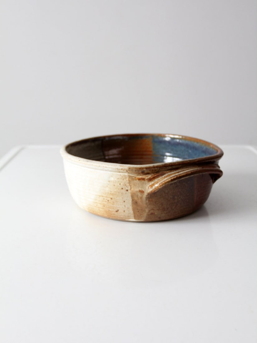 Handmade Vintage Studio Pottery Bowl with Geometric Glaze: Handmade Vintage Studio Pottery Bowl with Geometric Glaze Discover the beauty of this vintage studio pottery bowl, expertly handmade and wheel turned. This unique serving dish showcases double shoulde