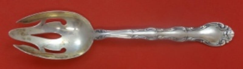 Alvin French Scroll Sterling Silver Slotted Serving Spoon 8.5": Alvin French Scroll Sterling Silver Slotted Serving Spoon 8.5" Enhance your dining experience with this exquisite Sterling Silver Slotted Serving Spoon from the renowned French Scroll pattern by Alvin