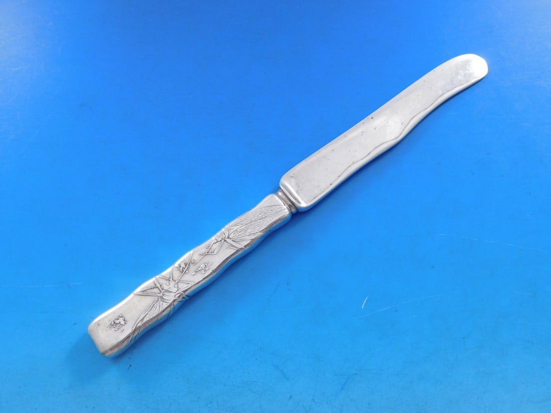 Tiffany Sterling Silver Lap Over Edge Dessert Knife 7 1/4" Cicada Design: Tiffany Sterling Silver Lap Over Edge Dessert Knife 7 1/4" Cicada Design This exquisite dessert knife features the Lap Over Edge pattern, acid etched by Tiffany & Co. Crafted from all-sterling silver,