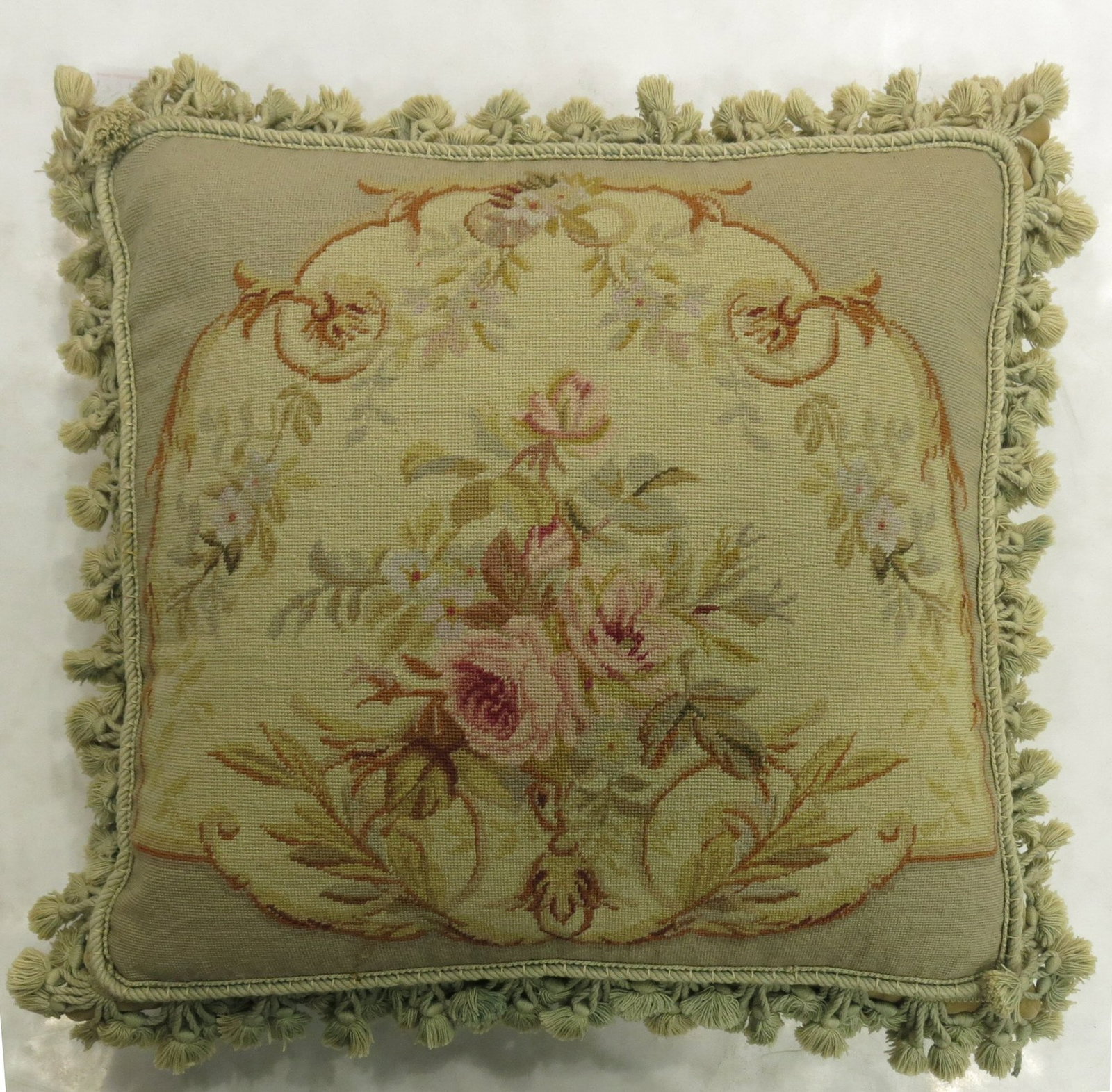 French Aubusson tapestry pillow 19th century 1' 7" x 1' 9": French Aubusson tapestry pillow 19th century 1' 7" x 1' 9" Elegant 19th century French Aubusson pillow with green tasseled corners. This pre-owned decorative pillow is sewn shut and features classic A