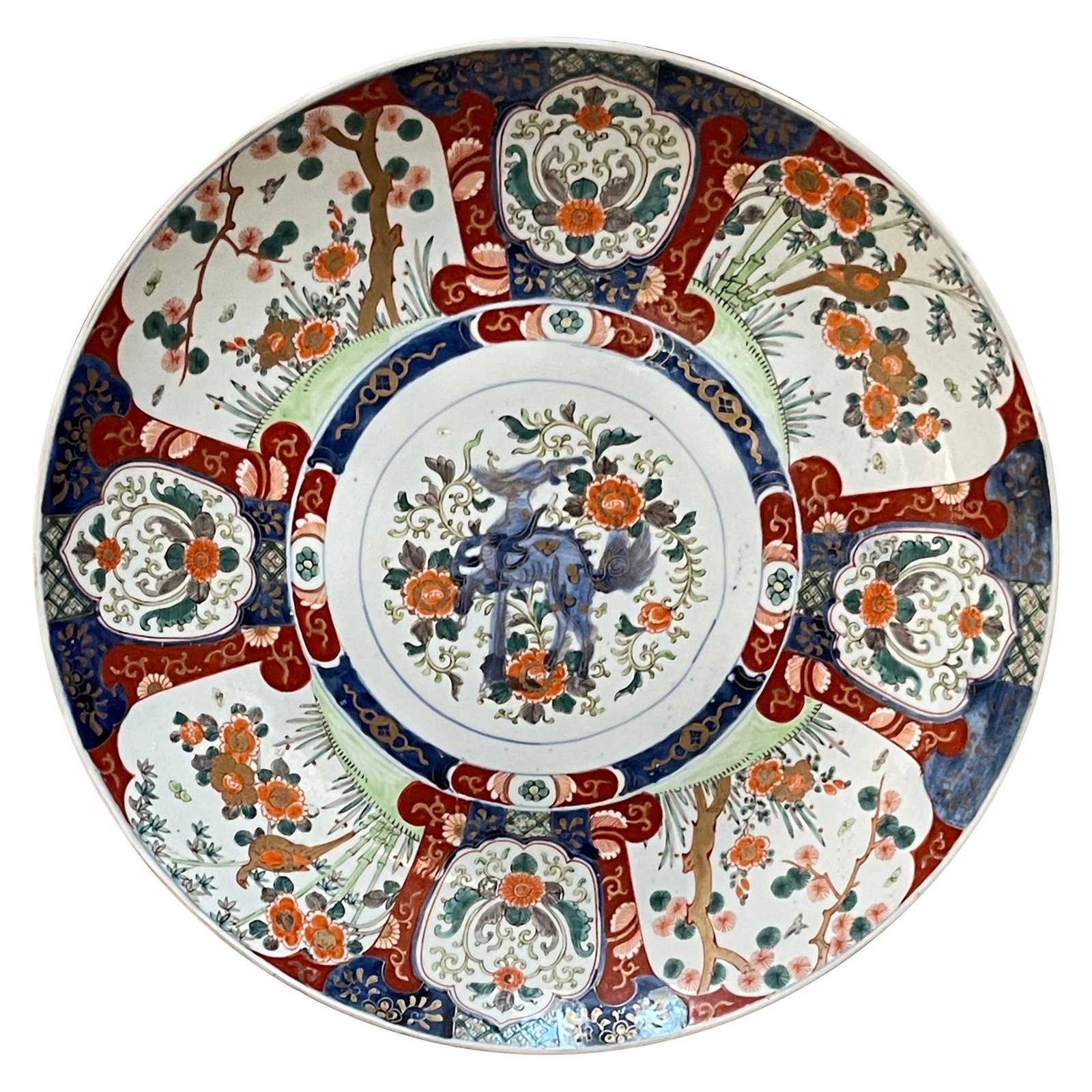 Meiji Period 18 Inch Imari Foo Dog Charger by Fukagawa: Meiji Period 18 Inch Imari Foo Dog Charger by Fukagawa Experience the elegance of the Massive Meiji Period Imari Foo Dog Charger, attributed to the prestigious Fukagawa factory in Japan, dating back t