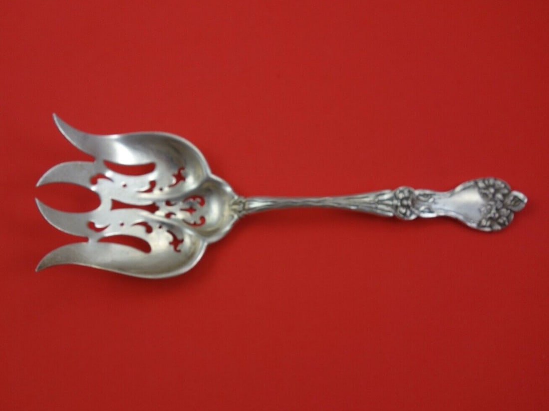Alvin Majestic Sterling Silver Salad Serving Fork 7 5/8": Alvin Majestic Sterling Silver Salad Serving Fork 7 5/8" This exquisite salad serving fork is crafted from sterling silver and features the elegant Majestic pattern by Alvin. Measuring 7 5/8 inches, i