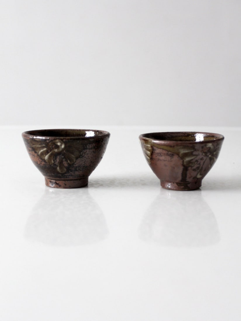 Vintage Studio Pottery Bowl Pair Hand Painted Floral Design: Vintage Studio Pottery Bowl Pair Hand Painted Floral Design Pair of vintage handmade studio pottery bowls with hand-painted floral decoration in olive and cream over a rich iron-brown glaze. Their gen