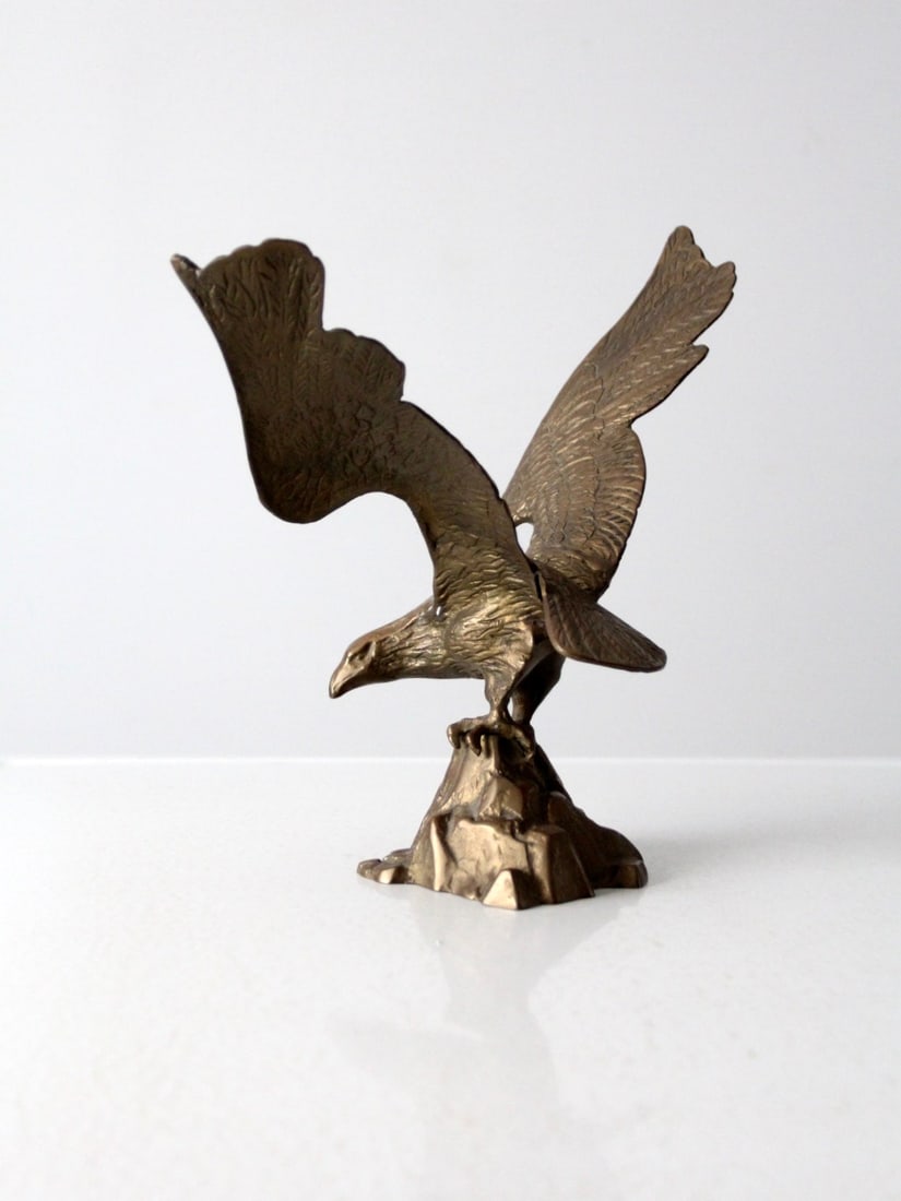 Vintage Brass American Eagle Statue 12.25 inch Height: Vintage Brass American Eagle Statue 12.25 inch Height This vintage brass eagle statue beautifully captures the majesty of the American bald eagle perched atop a rock. The heavy brass construction feat