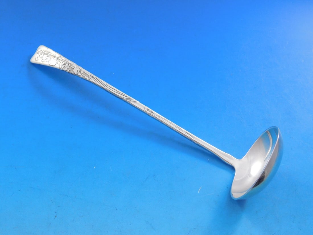 Tiffany & Co. Sterling Silver Sauce Ladle 7" Lily of the Valley Lap Over Edge: Tiffany & Co. Sterling Silver Sauce Ladle 7" Lily of the Valley Lap Over Edge This exquisite sauce ladle from Tiffany & Co. features the elegant "Lily of the Valley" motif and showcases the renowned "