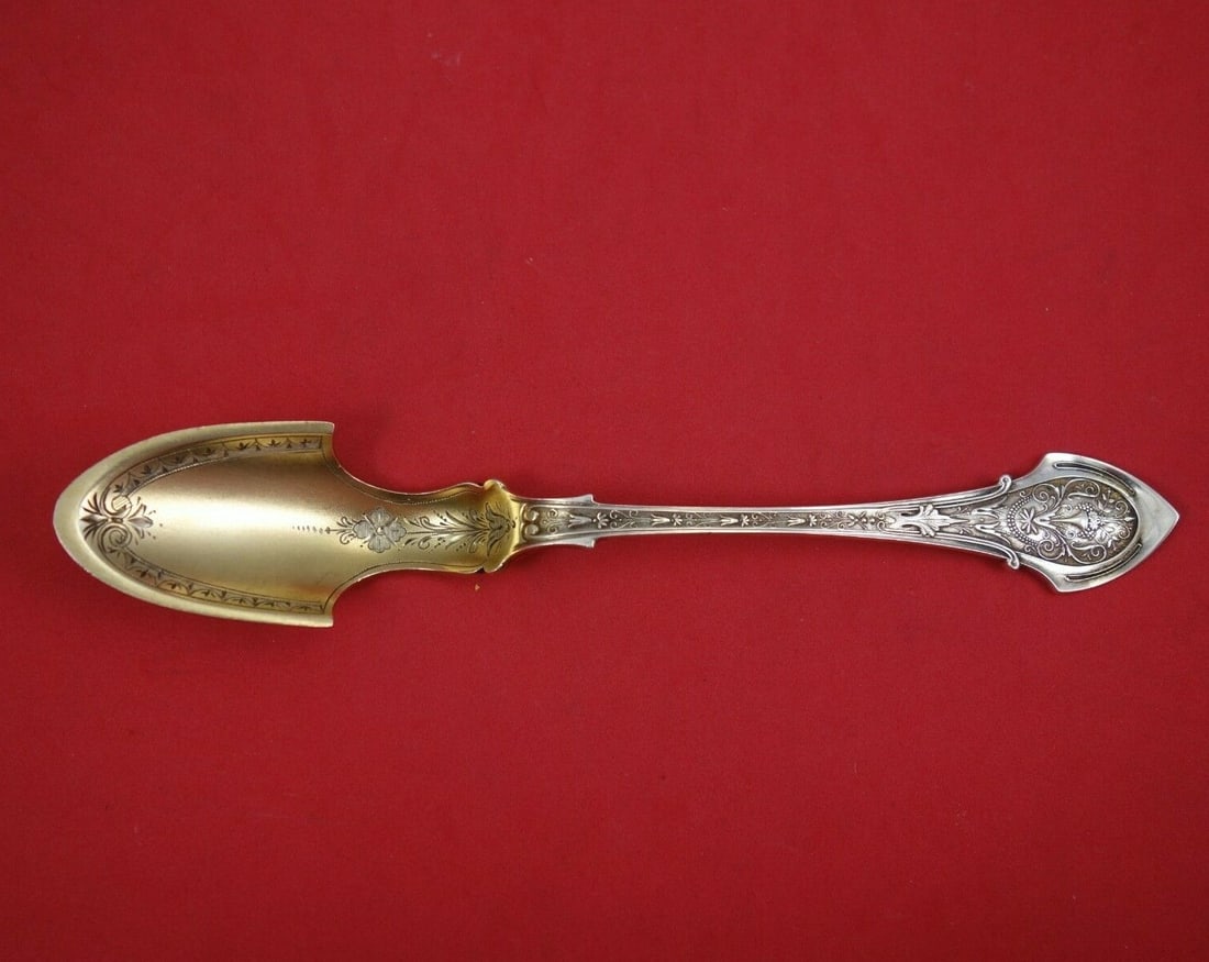 Wood & Hughes Angelo Sterling Silver Cheese Scoop Gold Washed 1883 7 3/4": Wood & Hughes Angelo Sterling Silver Cheese Scoop Gold Washed 1883 7 3/4" This exquisite cheese scoop, crafted by Wood & Hughes in the Angelo pattern, is a stunning example of sterling silver artistry